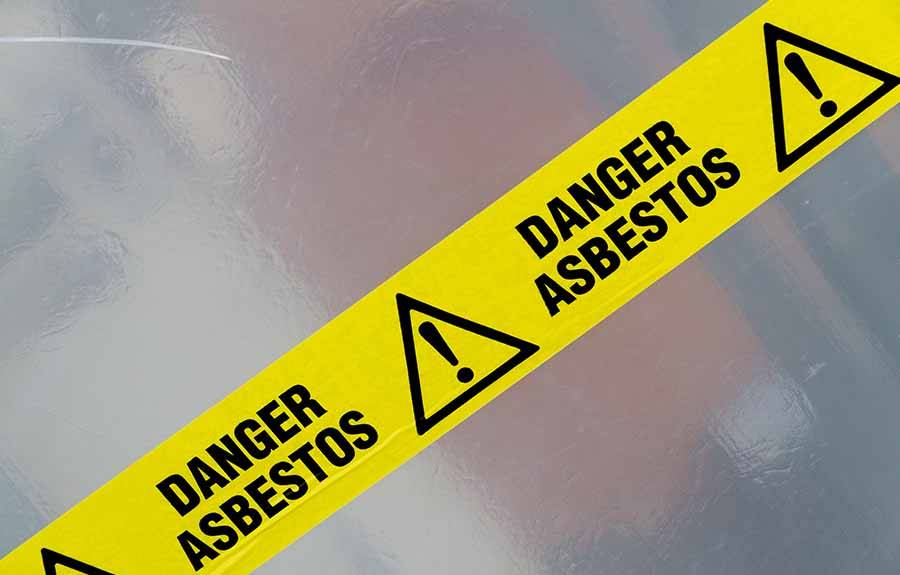danger asbestos sign on protective sheeting